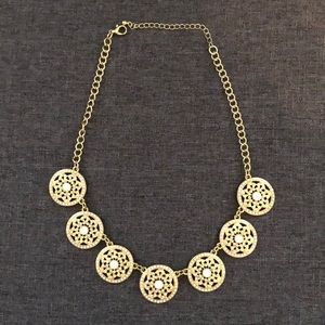 Gold and white necklace
